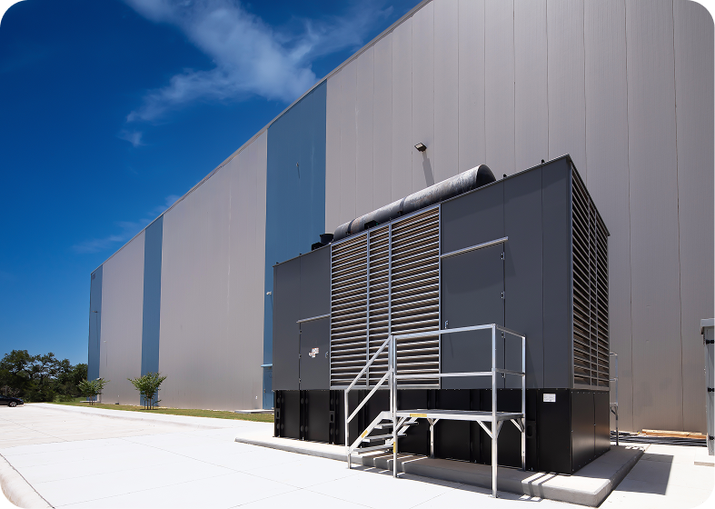 Backup power generator beside warehouse