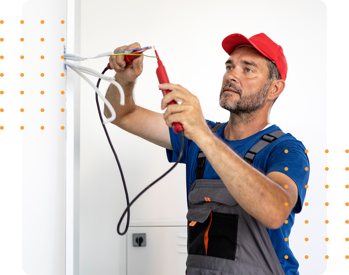 Technician fixing wires indoors