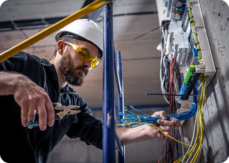Electrician working on wiring panel