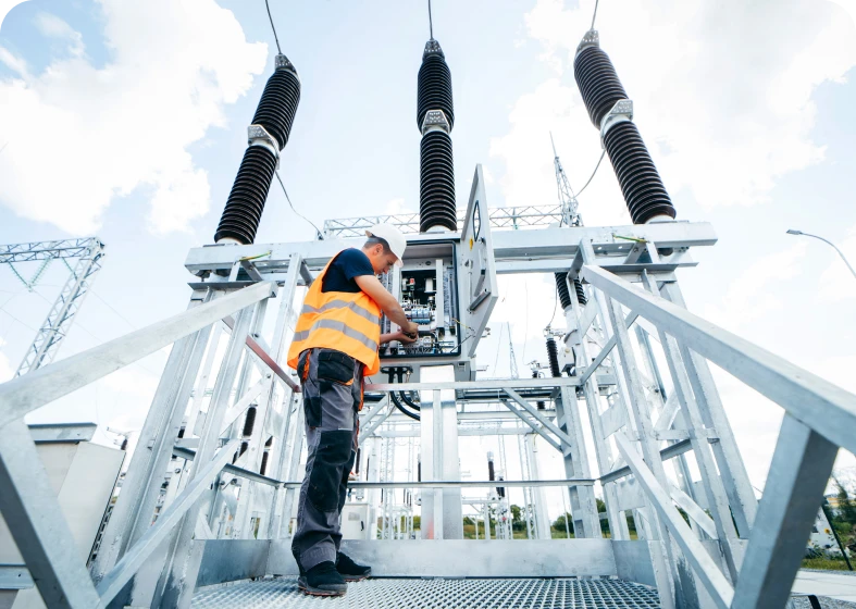 Engineer working on electrical substation equipment
